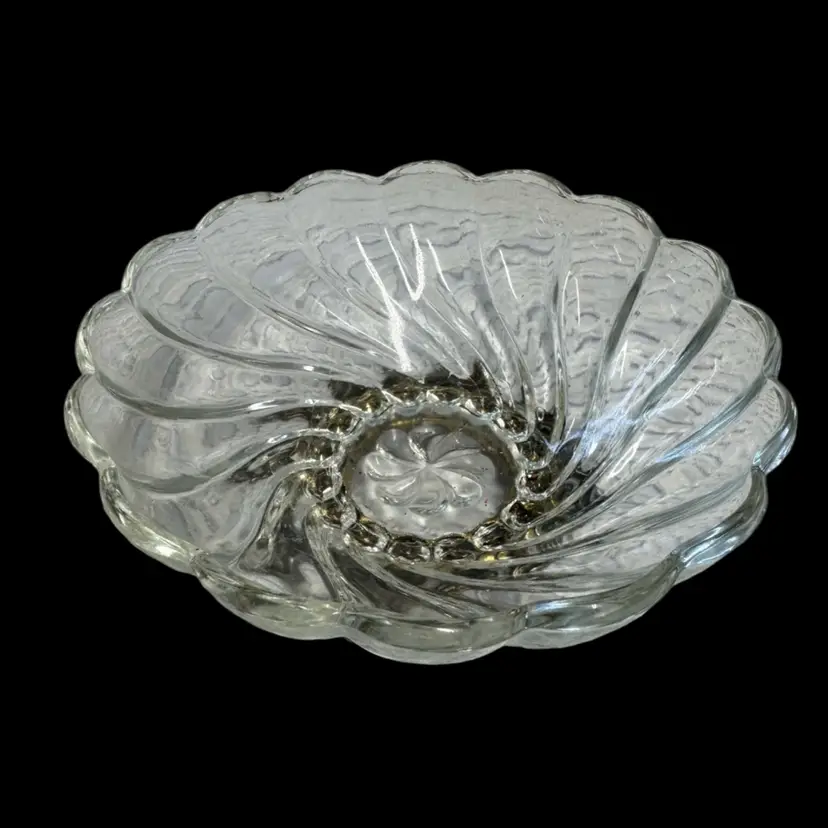 Pressed glass scalloped bowl with a decorative metal base.