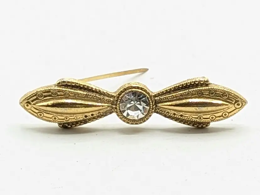 Vintage Gold Tone Bow Brooch with Rhinestone Center