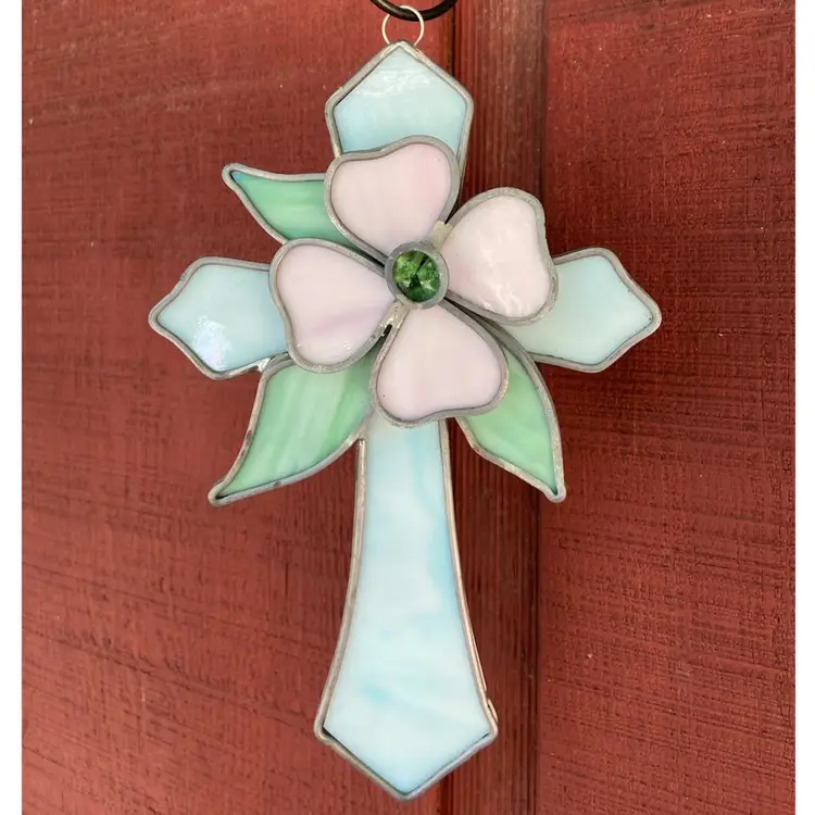 Slag Glass Hanging Sun catcher. Teal, Cross Shape With Pink Flower, Green Leaves And Green Glass Center. 9”h Including Hanger.