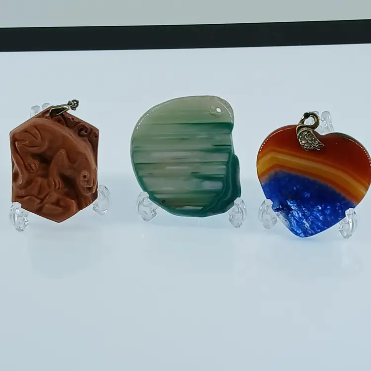 Five Polished Gemstone Pendants