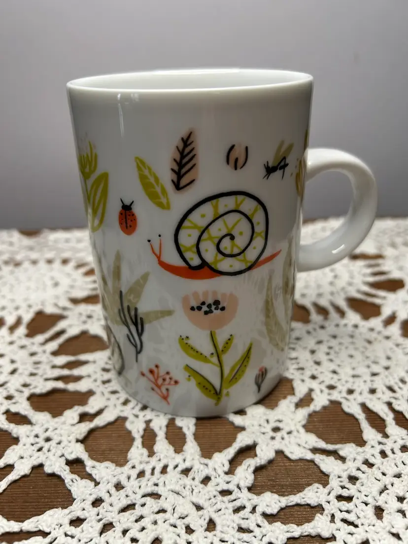 Danica Studio Small World @4 3/4” Tall Mug With Snails And Ladybugs And Florals