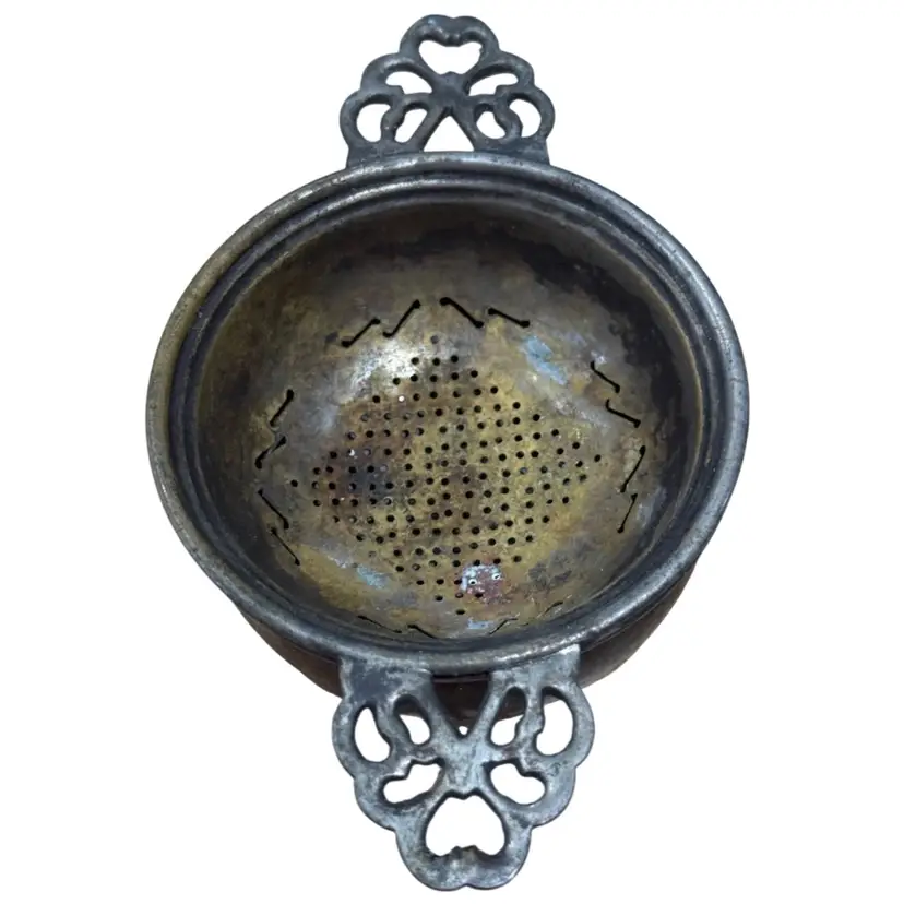 antique silver-plated tea strainer