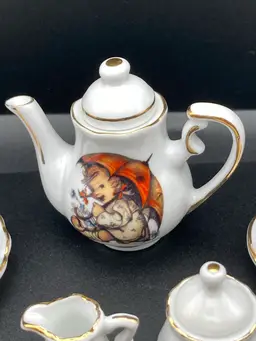 Tea For Two! Miniatures! MJ Hummel Porcelain Umbrella Girl Made In Germany Teapot And 2 Saucers (Teapot 2 1/2” T X 2 1/2” W Saucers 2” Diameter)