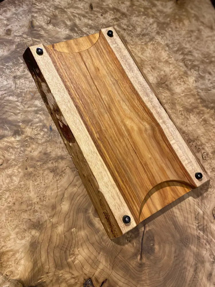 Live edge Canarywood cutting board with integrated plate slide handles