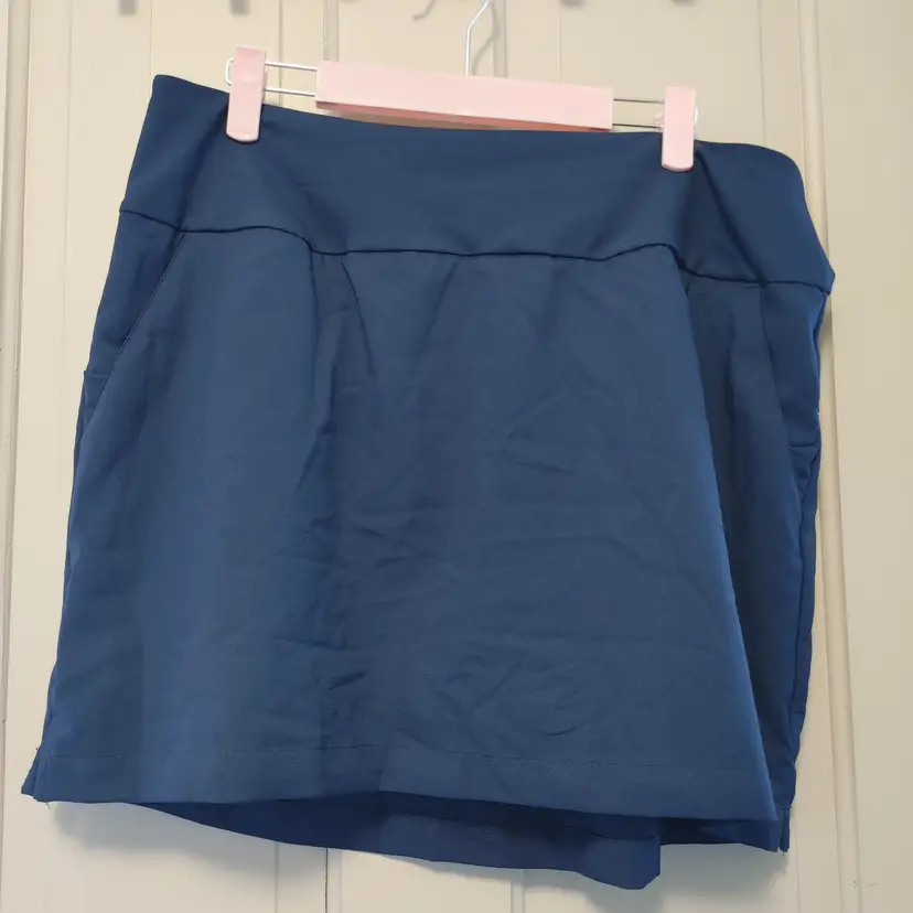Bottoms- Brand: Adidas. Size Large. Navy Golf skirt with built in shorts. Material: 100% polyester. No callouts.