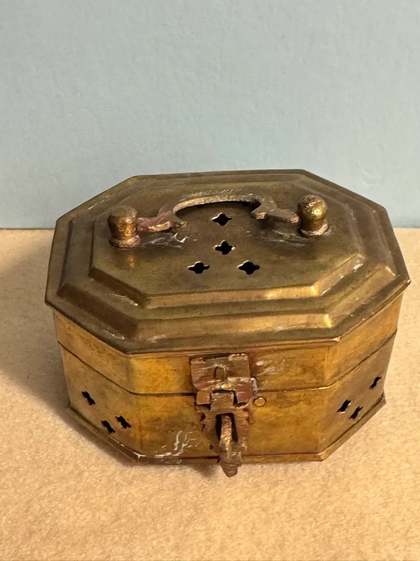 Vintage octagonal brass trinket or incense box with decorative cutouts