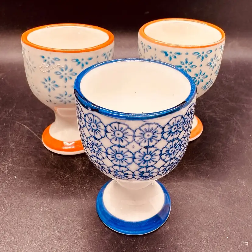 58. Set of 3 Nicola Spring Hand-painted porcelain egg cups. Japanese-inspired floral patterns