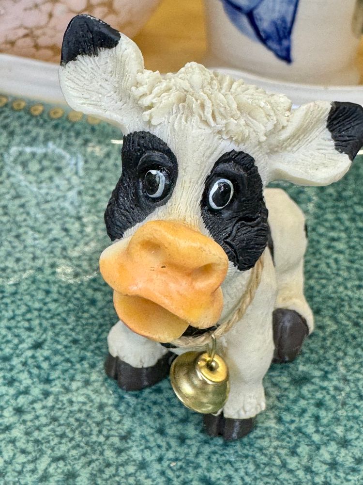 Mini whimsical resin figurine of a cow