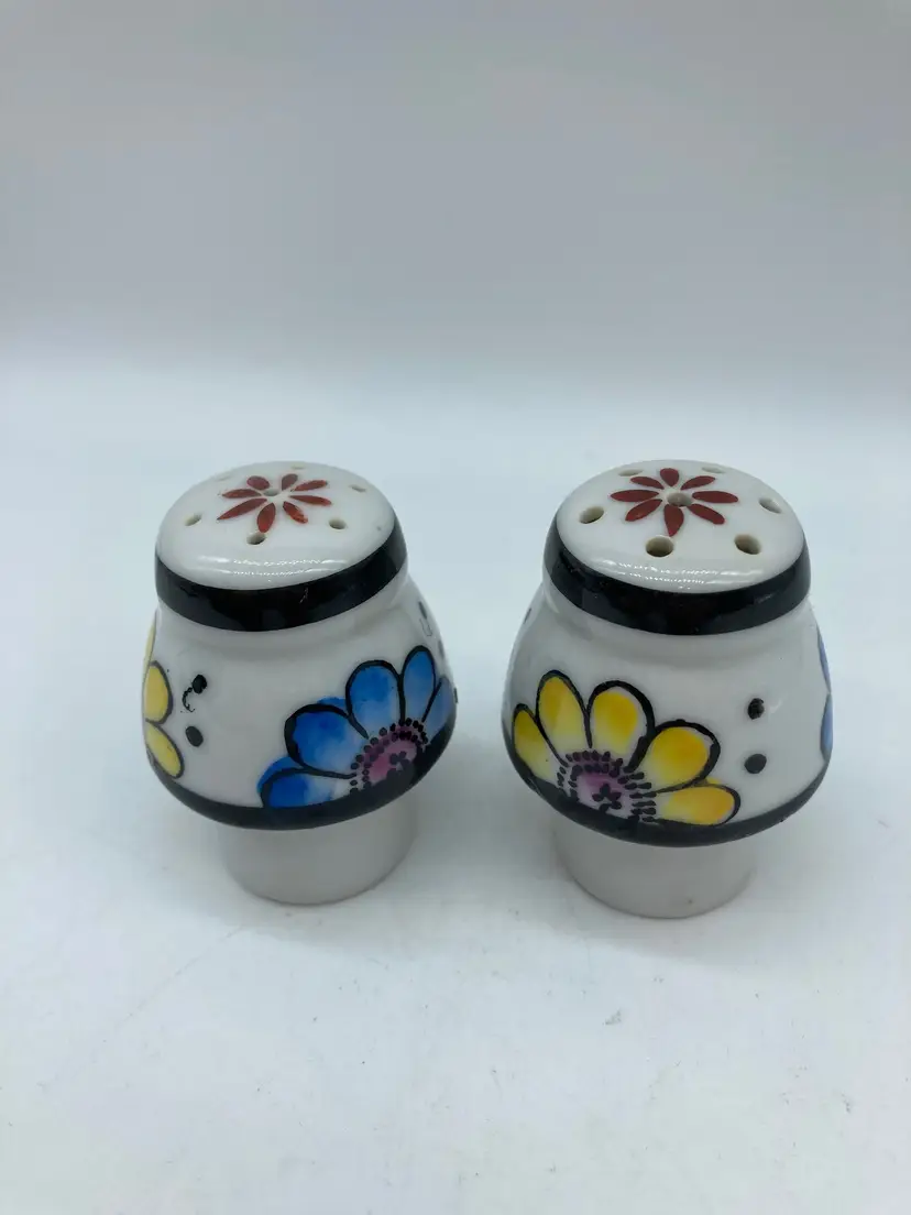 vintage Japanese ceramic salt and pepper shakers featuring a hand-painted floral design