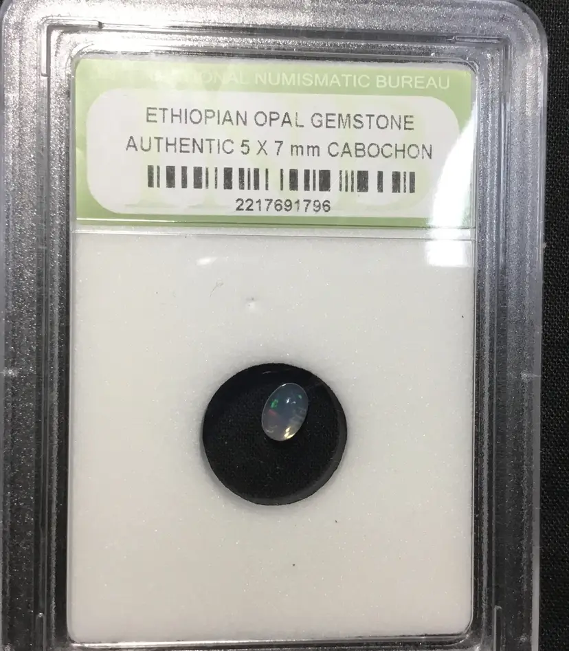 .5 carat Ethiopian precious opal cabochon, 7 x 5 mm, not graded