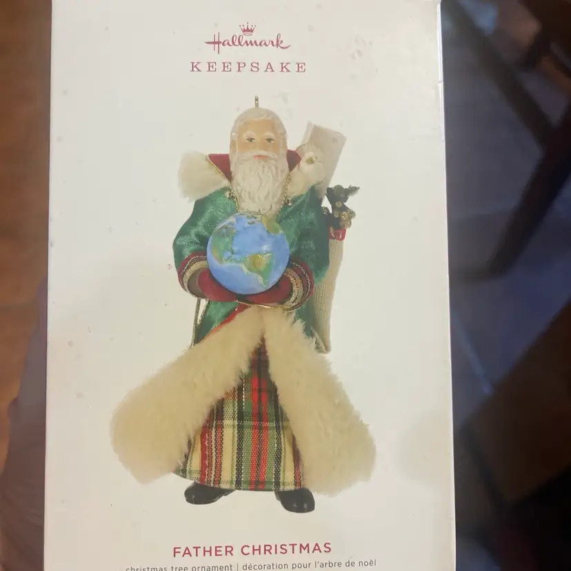 New in box 2019 Hallmark Keepsake Father Christmas holding Earth series Ornament