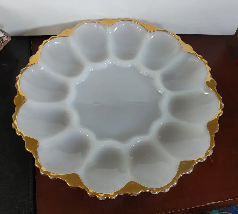 Anchor Hocking milk glass deviled egg plate with cold trim. 10 inch diameter. No chips or cracks.