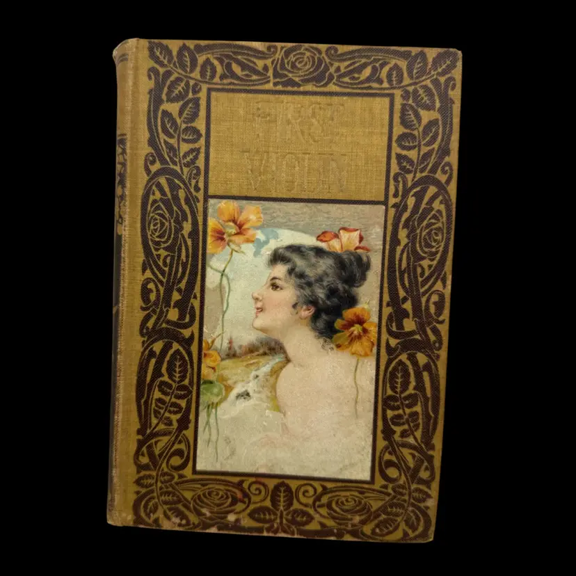 "The First Violin" 1907 Republished Edition by Jessie Fothergill, first published in 1877. It was a popular work in its time, often reprinted in various editions throughout the late 19th and early 20th centuries. The novel is known for its musical themes and its exploration of character relationships.