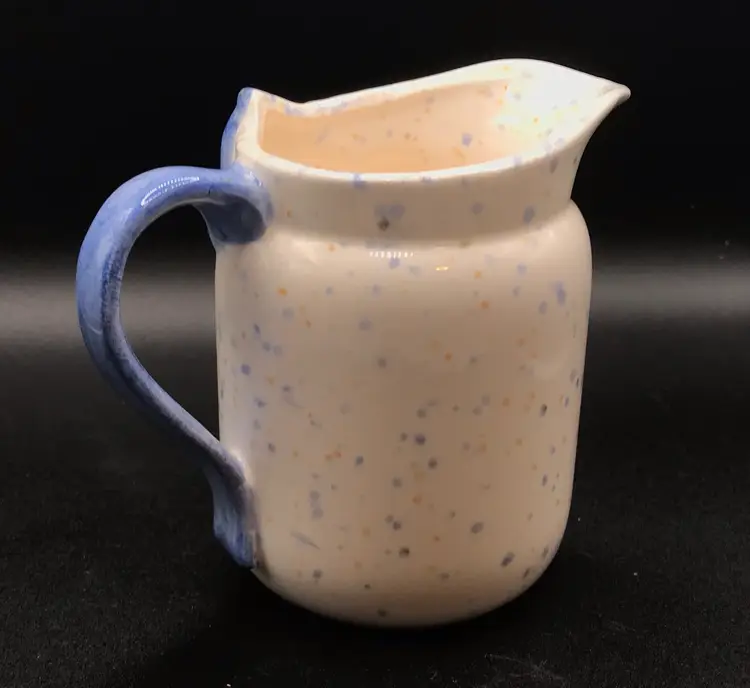 Vintage speckled ceramic creamer w blue bow
