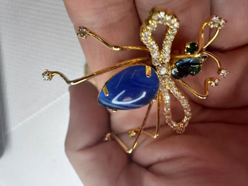 gold tone wild animal Bug Brooch with blue stone and green eyes