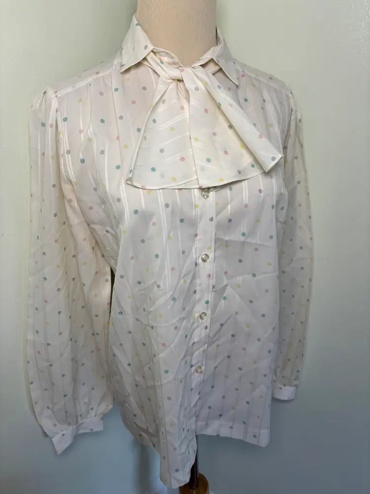 Vintage 1980s ladies Koret rainbow polka dot button up blouse with bow tie closure and puffy sleeves 