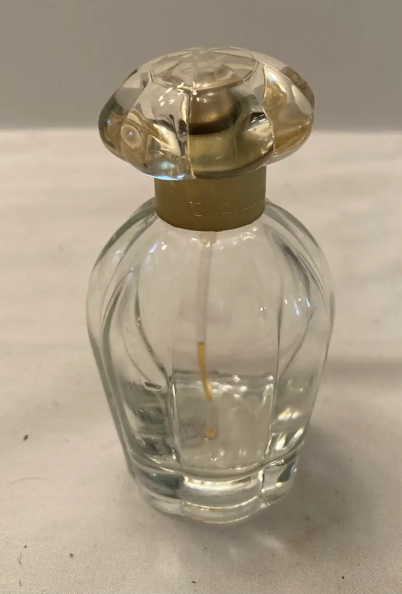 Clear Perfume Bottle By Oscar De La Renta