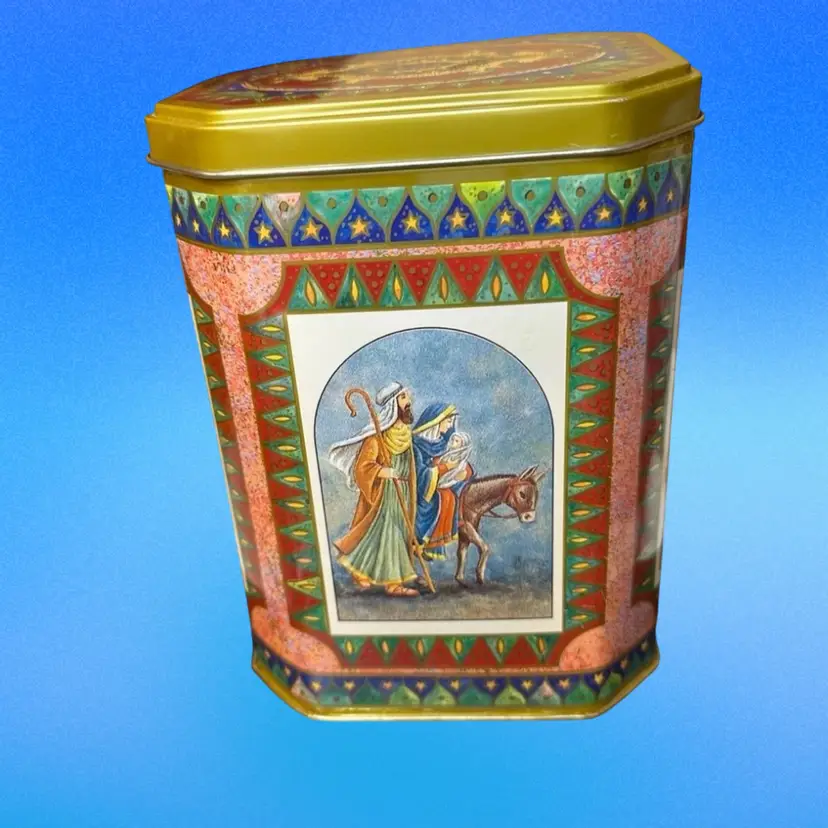 Vintage biscuit tin, likely manufactured in the U.K., featuring Christmas nativity scenes