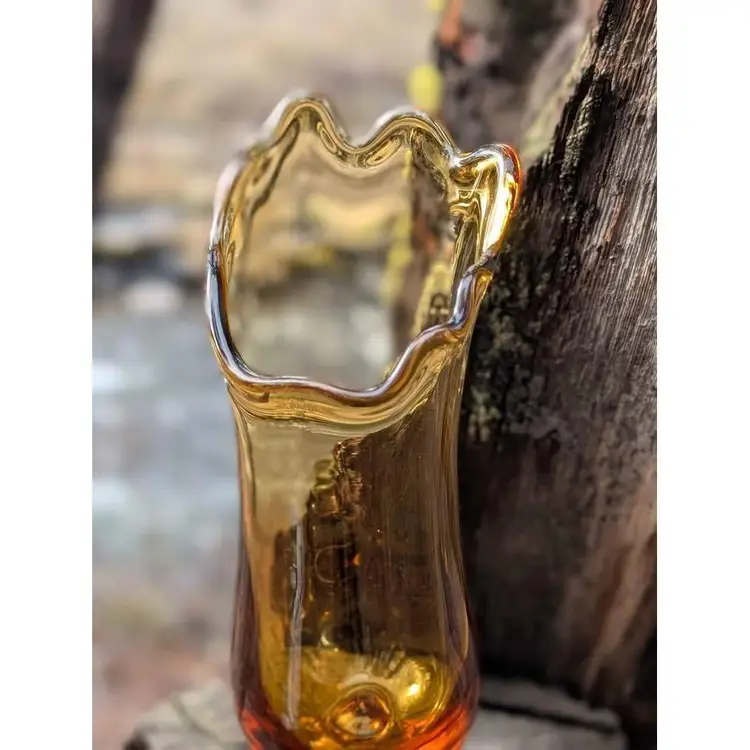 Vintage Amber glass swung draped vase with footed bottom