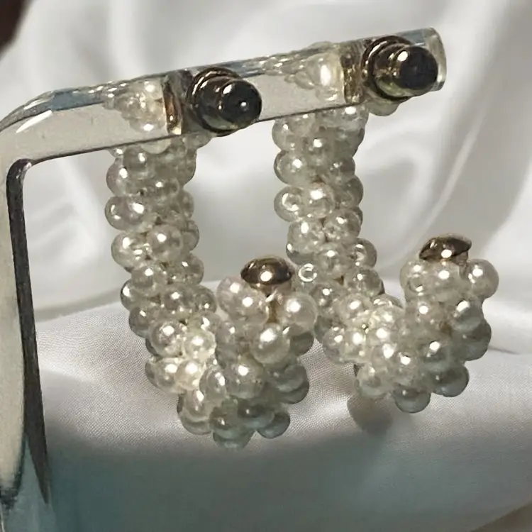 Fabulous pair of white faux pearl hoop earrings in C shape, they would make a lovely present for special occasions or just a treat for yourself. These statement hoop earrings will be a perfect addition to your wardrobe. Earrings are for pierced ears only. 
Combine Shipping Available 
