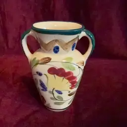 A Beautiful vintage hand-painted ceramic vase.  Japanese porcelain, featuring a floral design and double handles.