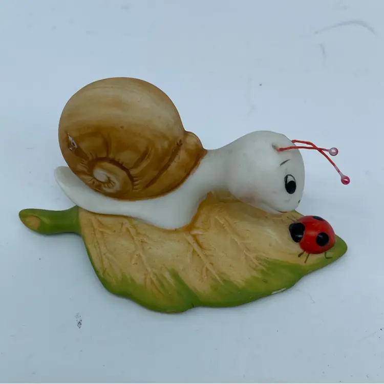 #1443 Pair of Homco ceramic snail figurines with a Ladybug and Caterpillar