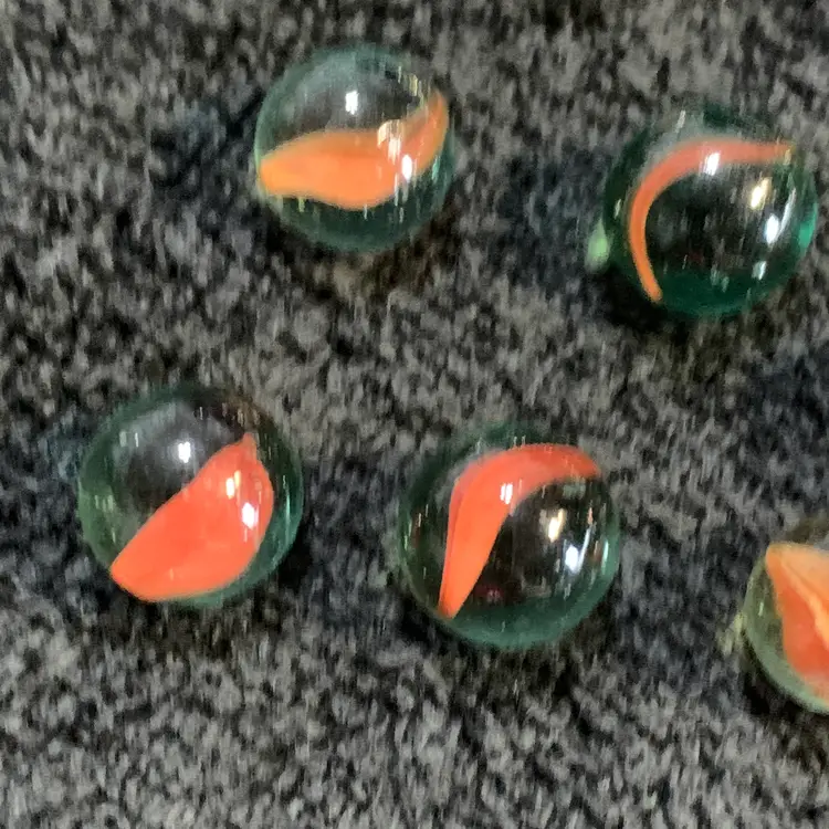 9-Clear w/Orange Swirl Glass Marbles