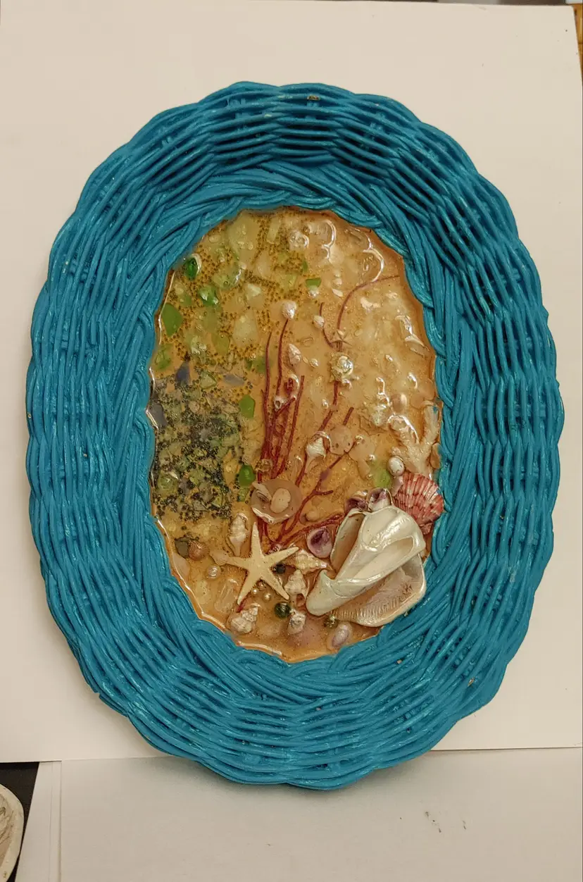 Teal Wicker Frame with resin coated beach center. Folk art. 1940-60. 9.5 x 12. Good condition.