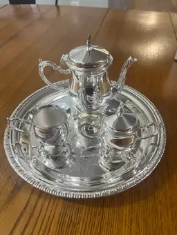 Silver Plated, Goldinger four piece, miniature coffee set with box
Includes Coffee, Pot Creamer, Sugar Bowl With Lid And Serving Tray . Tray Is 9.5 Inches.