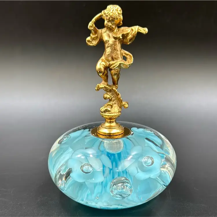 Vintage baby blue art glass trumpet flower paper weight Married Italian gold tone cherub With Paper Weight.