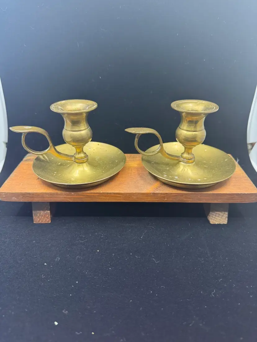 A pair of vintage brass chamber candlesticks with finger loop handles, 3.25”