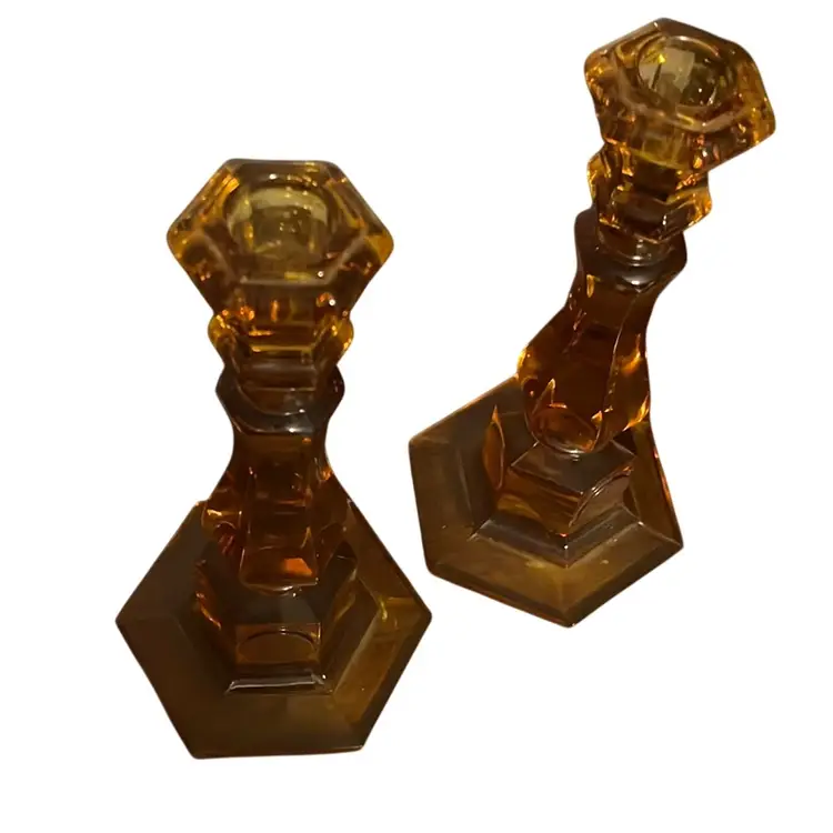 A pair of Fostoria amber coin glass candlesticks.8” 1956-1986