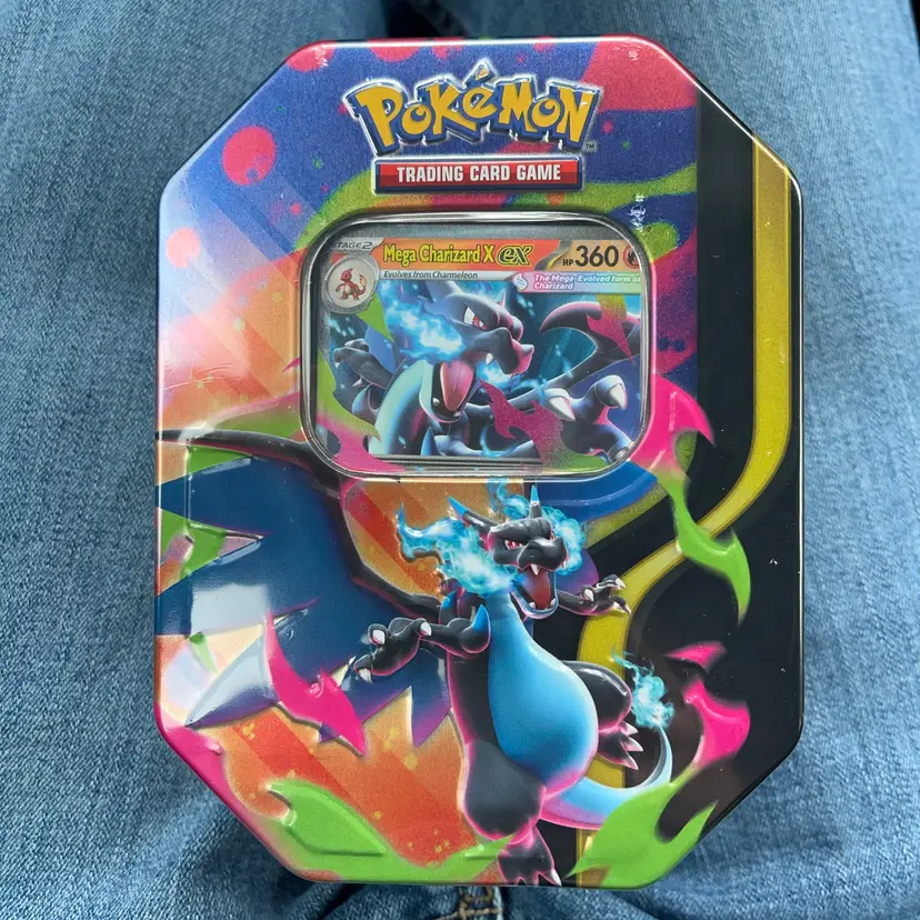 Pokémon Trading Card Game: Spring 2026 Tin featuring Mega Charizard X.