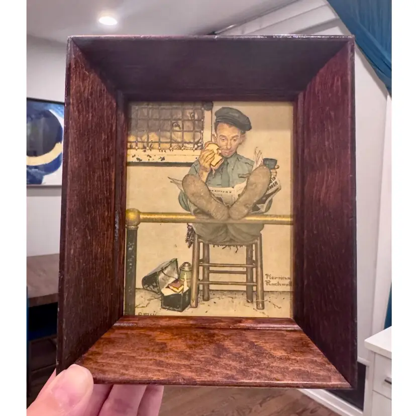 6.5”x5.5” framed print of the Norman Rockwell painting titled "The Lion's Share," which was originally featured on the January 9, 1954 cover of The Saturday Evening Post