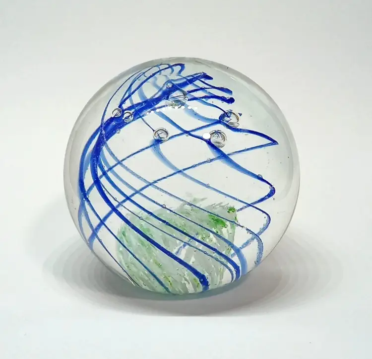 Art Glass Paperweight Sphere Blue Swirl Green & White Center Bubbles 2½"   Clear glass with blue swirls.  Green & white center.  Bubbles.  Unmarked.  Aprox 2½" tall.  No chips or cracks.