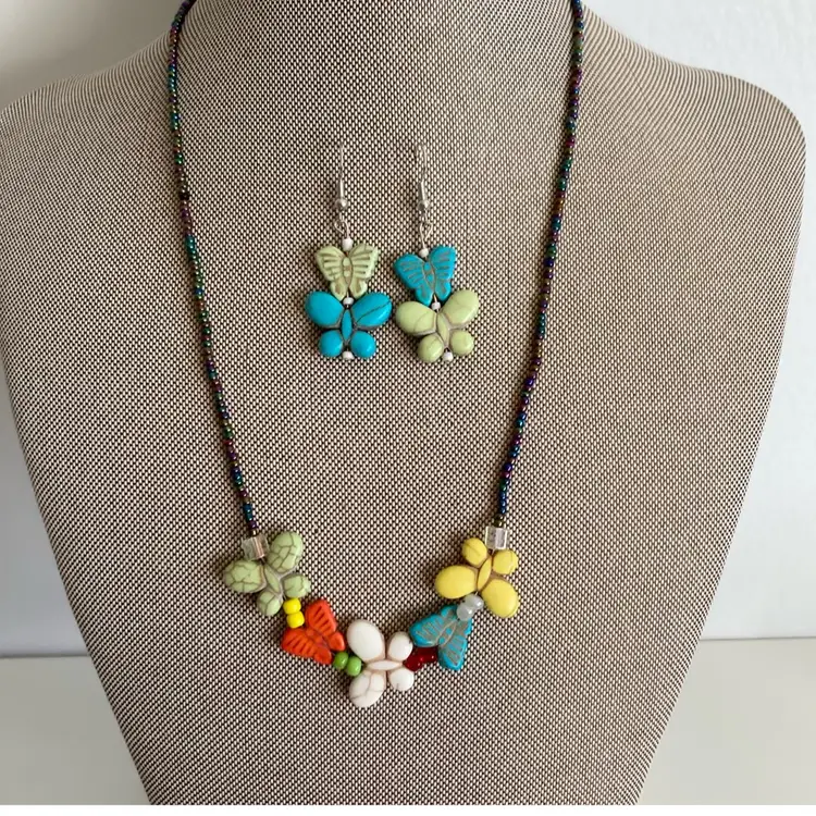 Iridescent Aurora Borealis Beaded Necklace with Carved Howlite Butterflies And Matching Earrings