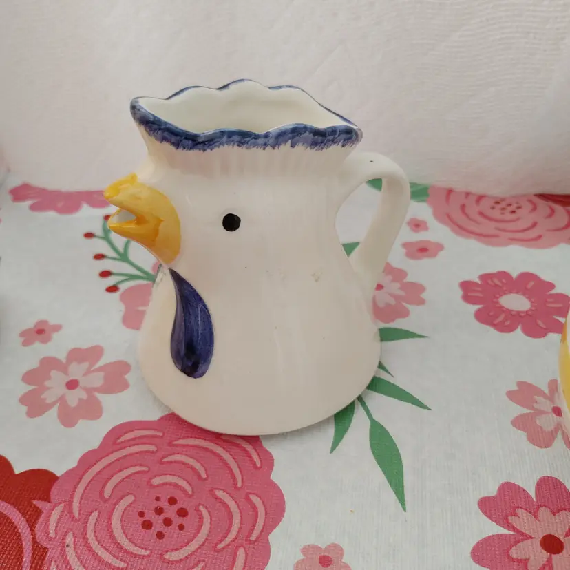 Chicken creamer. Small chip at base. Some crazing. 4 inches high.