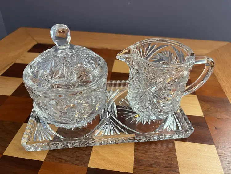 Vintage pinwheel cut crystal cream and sugar set with tray And Lid.