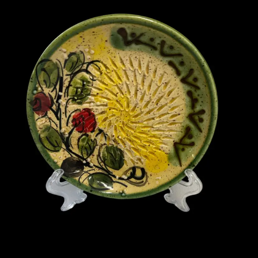 Hand-painted ceramic garlic grater plate with rose motif from Spain.