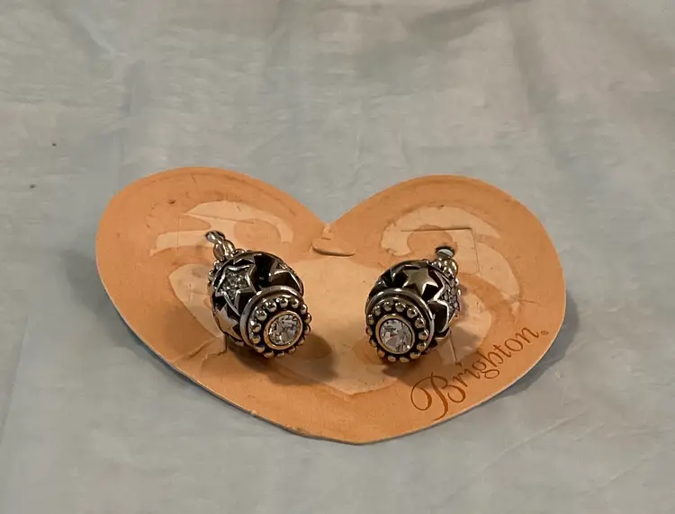 #01 Brighton shimmering star earrings with crystal on end. They drop 1 1/4”.