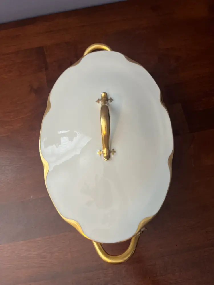 A white porcelain Haviland Limoges Silver Anniversary covered vegetable tureen.
13x6”