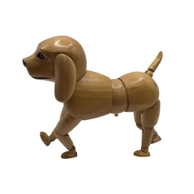 Articulated wooden dog mannequin commonly used as a model for artist drawings and sculpture.  No Longer On Stand. 5” X 5”