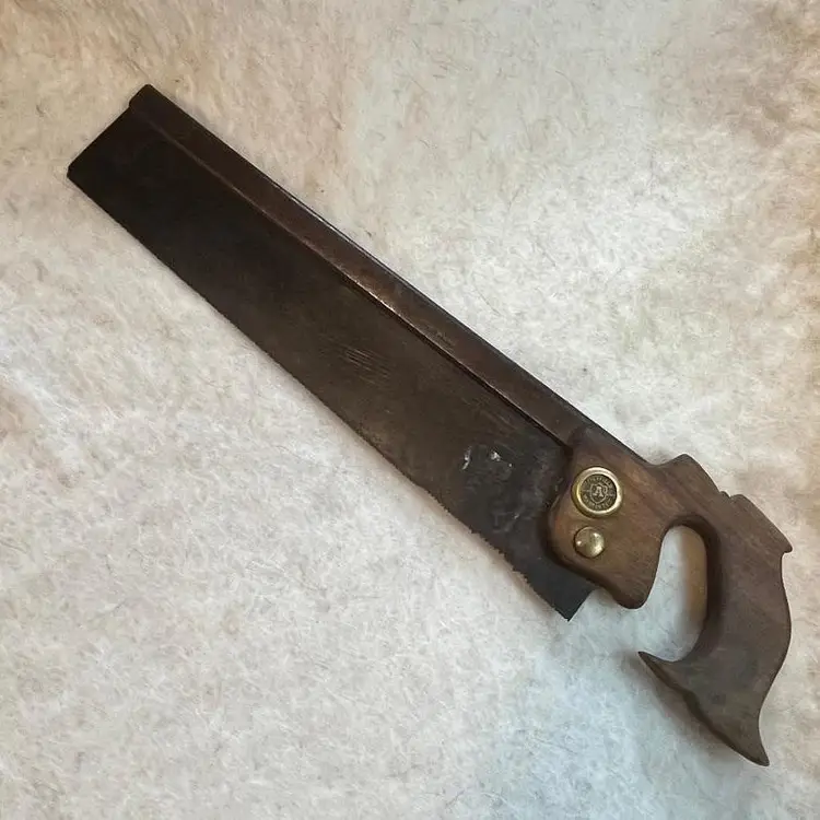 Garber & Genn 14" Back Saw. 
German Steel lightly stamped under maker's mark. Straight blade, 12 PPI. A number of hand-cut teeth near the handle. Handle may be a repair or replacement.