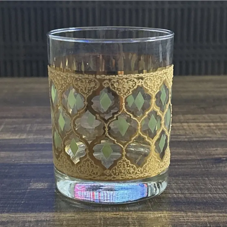 Used. An item that has been used previously. The item may have some signs of cosmetic wear, but is fully operational and functions as intended. This item may be a floor model or store return that has been used. See the seller’s listing for full details and description of any imperfections. See all item conditions. Vintage Culver “Valencia” lowball glass, featuring the signature 22-karat gold lattice design with olive-green diamond insets. A striking example of Mid-Century Modern barware, known for its elegant geometric motif and rich metallic detailing. Perfect for whiskey, cocktails, or as a collectible display piece.   Details:  • Brand: Culver Ltd.  • Pattern: Valencia  • Style: Lowball / Old Fashioned Glass  • Era: Mid-Century Modern (1960s)  • Material: Glass with 22K gold overlay and green enamel accents