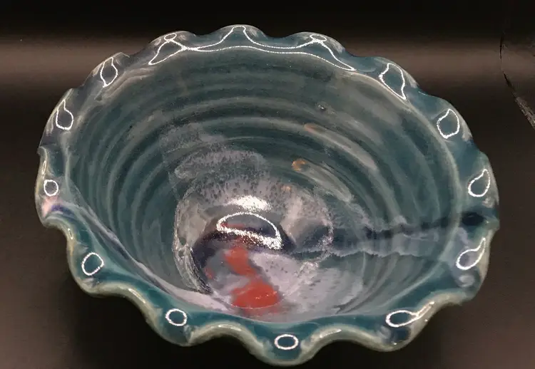 Stamped ruffled pottery bowl made in USA