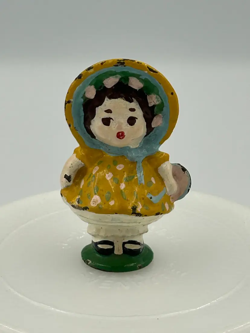 Vintage Small Cast Iron Little Girl And Yellow Dress And Sun Bonnet Figurine