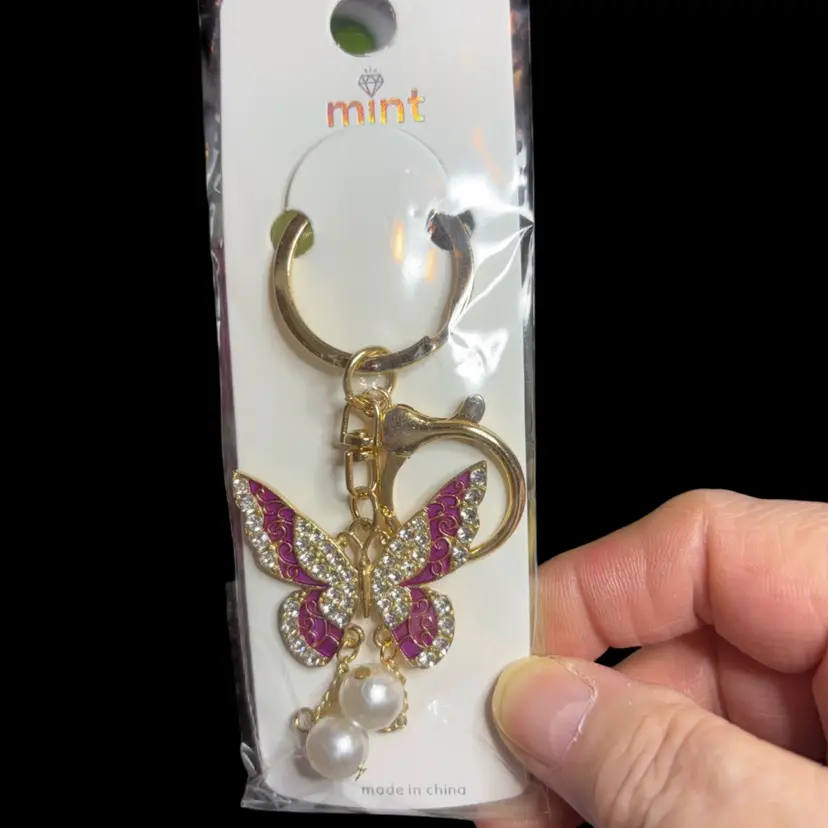 Beautiful Gold Tone Keychain With Purple Colored Butterfly, Clear Gemstones And Faux Pearls