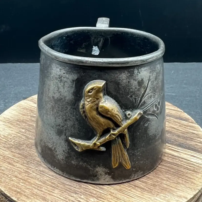 #392B Vintage Quadruple Plate Cup With Brass Or Bronze Raised Bird Attached To The Side 
Makers Mark Of The Benedict Manufacturing Company