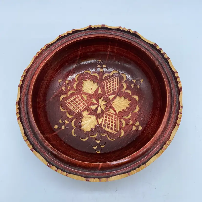 #4013 Hand-carved wooden bowl with floral inlay and decorative rim.