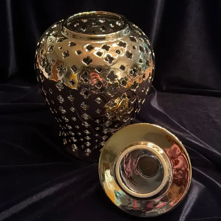 Vintage Gold Ceramic Pierced Ginger Jar/Temple Jar/Vase with Lid.   Beautifully crafted gold ceramic pierced ginger jar with lid, showcasing traditional Chinese culture and design. The intricate detailing and craftsmanship of the piece make it a unique and elegant addition to any collection.
